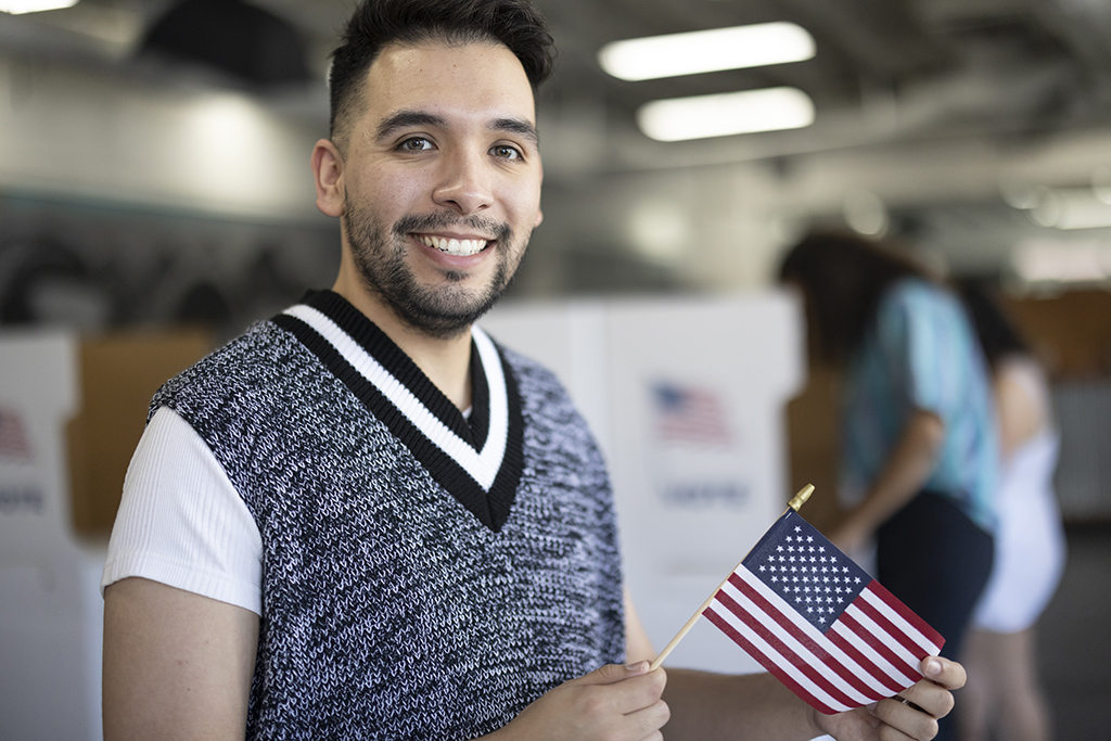 man holding a USA flag